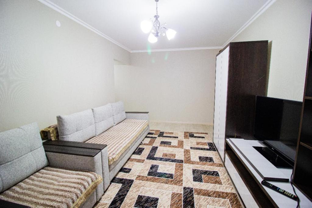 Flat in the city center 塔尔迪库尔干 外观 照片